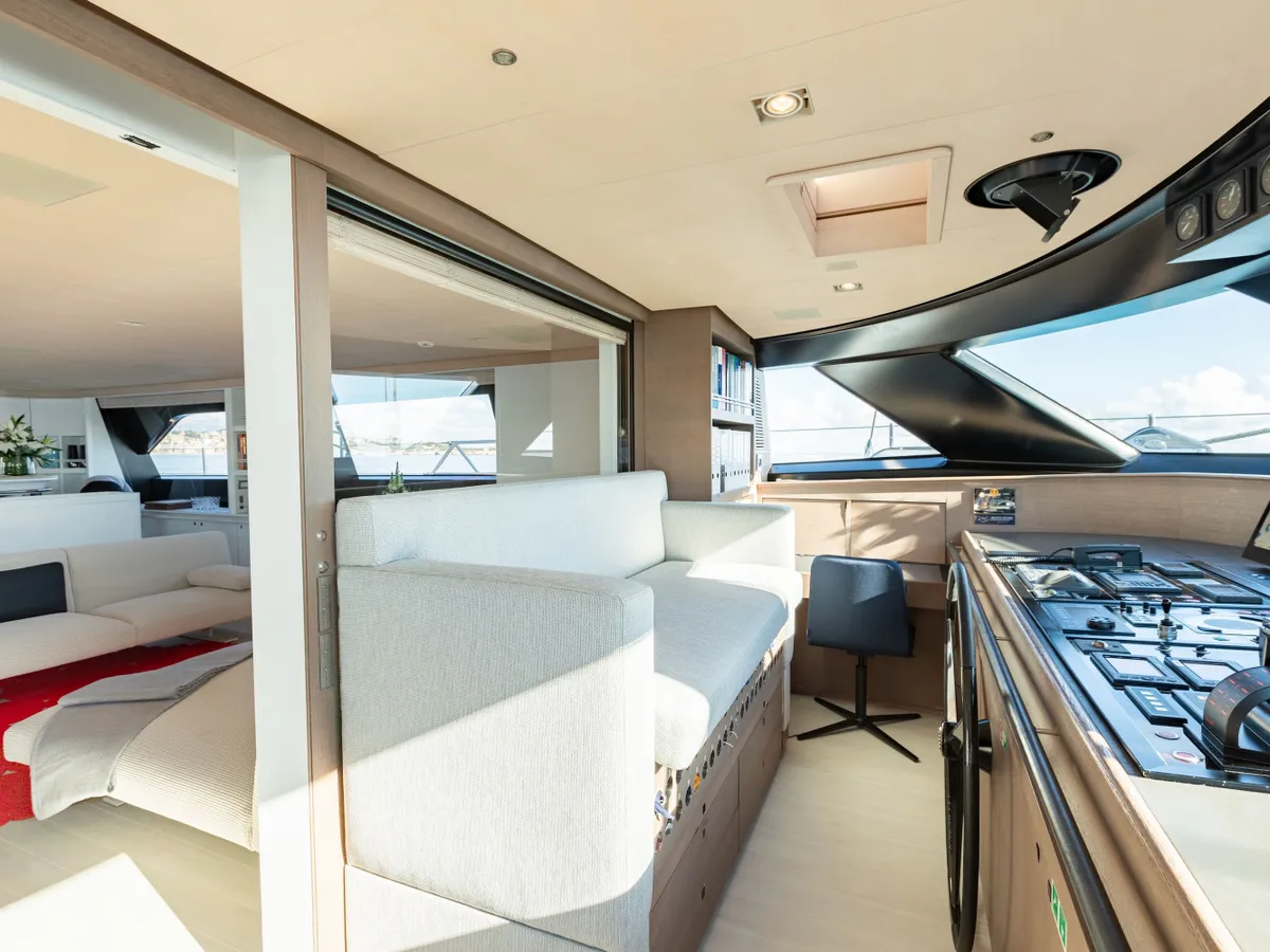 Wheelhouse navigation console and seating beside the saloon