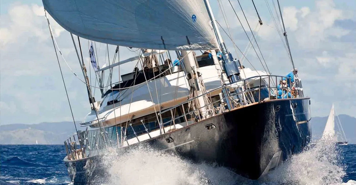 Serendipity I sailing towards the viewer, her bow lifting through the waves